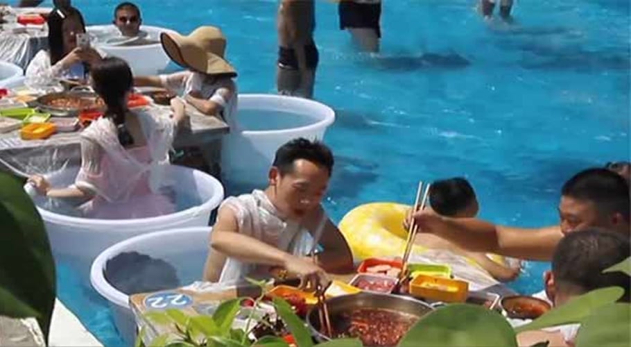 Chinese restaurant in swimming pool allows customers to cook their own food
