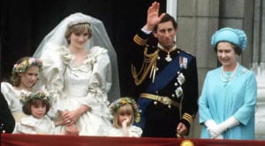 Prince of Wales Charles and Lady Diana pose on the balcony of Buckingham Palace on their wedding day with the Queen and some of their bridesmaids. (1981)