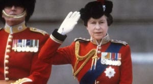 Queen Elizabeth II taking the salute of the Household Guards regiments during the Trooping the Colour ceremony in London (1985).
