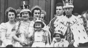 King George VI and Queen Elizabeth with Princesses Elizabeth and Margaret dressed in full Coronation regalia on the balcony of Buckingham Palace after the King’s 1937 Coronation ceremony.
