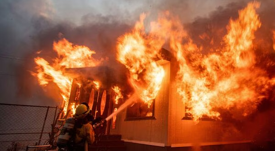 Los Angeles wildfires rage as strong winds put millions on alert
