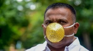 Indian businessman wears gold mask to prevent coronavirus