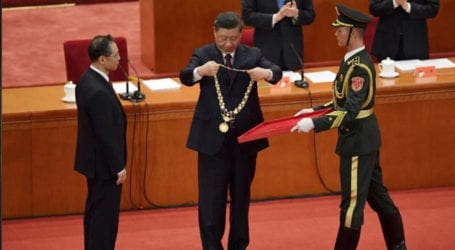 China awards medals to role models in COVID-19 struggle