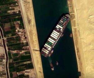 Dredgers struggle to refloat ship blocking Suez Canal
