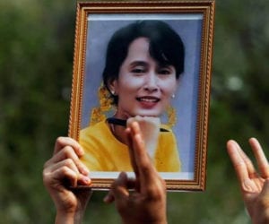 Myanmar junta accuses Suu Kyi of bribery, 12 protesters killed