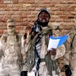 Boko Haram leader Abubakar Shekau speaks in front of guards in an unknown location in Nigeria. Source: Reuters