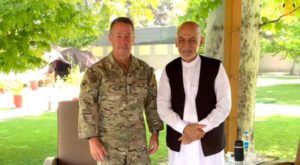 Afghanistan's President Ashraf Ghani (R) meets General Austin "Scott" Miller, commander of U.S. forces and NATO's Resolute Support Mission in Kabul
