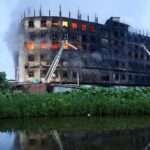 Flames rise the morning after a fire broke out at a factory on the outskirts of Dhaka. Source: Reuters.