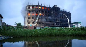 Flames rise the morning after a fire broke out at a factory on the outskirts of Dhaka. Source: Reuters.