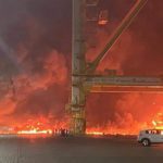 Plumes of smoke rise from a container ship anchored in Dubai's Jebel Ali port. Source: Online