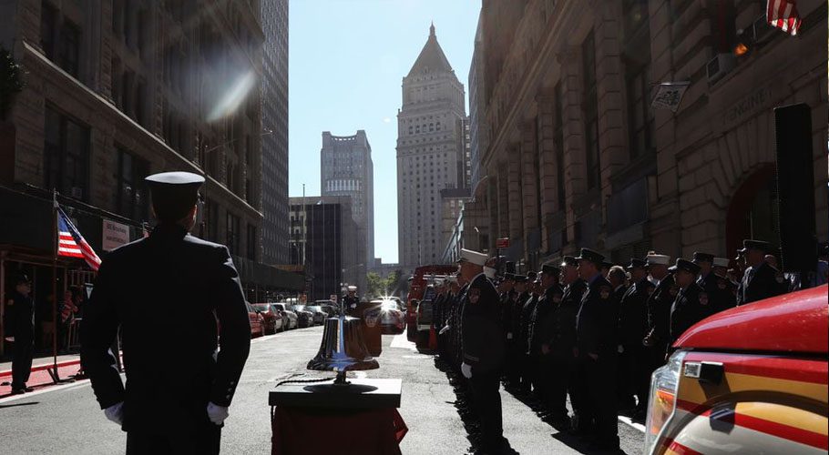 Firefighters pay respect during the 20th anniversary of the September 11, 2001 attacks in New York City. Source: Reuters.