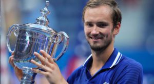 Daniil Medvedev of Russia celebrates with the championship trophy after his match against Novak Djokovic of Serbia. Source: Reuters.