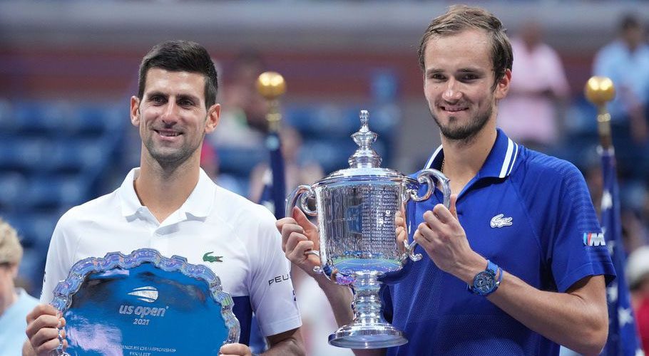 Novak Djokovic of Serbia and Daniil Medvedev of Russia celebrate with the finalist and championship trophies after their match in the men's singles final of the US Open tennis tournament. Source: Reuters.