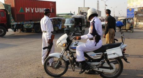 Traffic policeman injured as car runs over him in Karachi