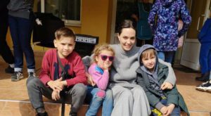 Angelina Jolie poses for a picture with children. Source: Reuters.