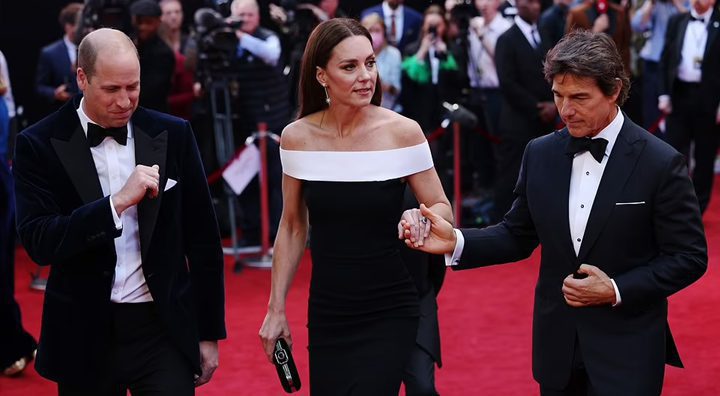 Tom Cruise was on hand to help the Duchess of Cambridge as she walked the red carpet. Source: Daily Mail.