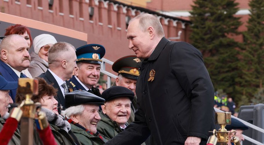Russian President Vladimir Putin shakes hands with spectators before a military parade on Victory Day. Source: Reuters.
