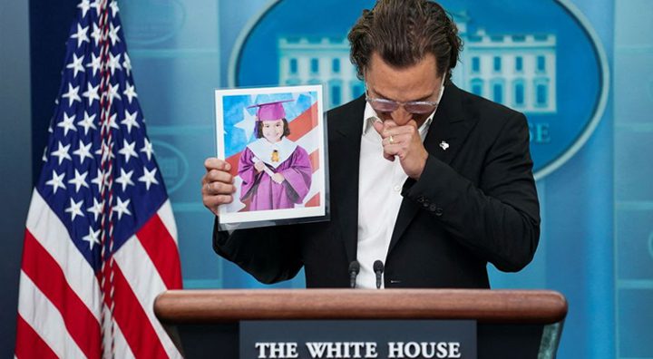 Matthew McConaughey becomes emotional as he holds up a picture of a young victim of the school shooting in Uvalde. Source: Reuters.