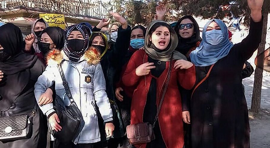 Afghan women chant slogans to protest against the ban on university education for women, in Kabul on December 22, 2022. - A small group of Afghan women staged a defiant protest in Kabul on December 22 against a Taliban order banning them from universities, an activist said, adding that some were arrested. — AFP