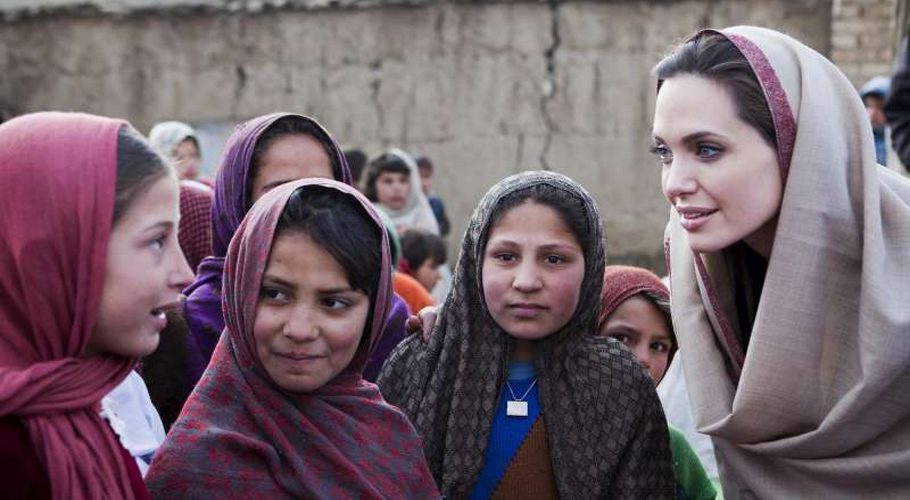 Angelina Jolie meets schoolgirls in a village in Afghanistan. She has been named Special Envoy of UNHCR chief, António Guterres.  © UNHCR/J.Tanner