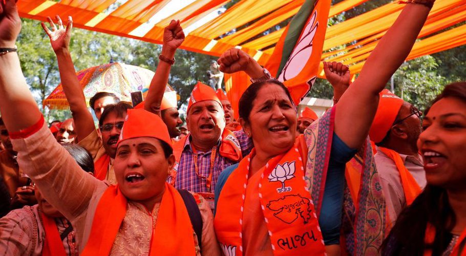 Supporters of India's ruling Bharatiya Janata Party (BJP) shout slogans as they celebrate after learning of the initial poll results of Gujarat state assembly election in Gandhinagar, India, December 8, 2022. REUTERS/Amit Dave