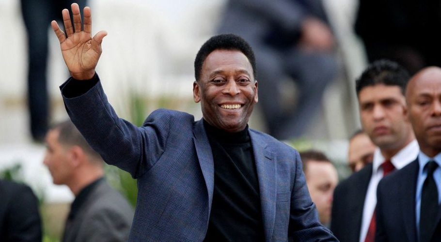 Brazilian soccer legend Pele waves during the international friendly soccer match between Algeria and Slovenia in Algiers, Algeria March 5, 2014. REUTERS/Louafi Larbi