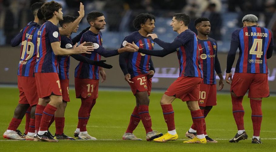 Barcelona forward Robert Lewandowski celebrates with his teammates after he scored his penalty kick during a semifinal of the Spanish Super Cup against Real Betis in Riyadh on January 12, 2023.  | Photo Credit: AP