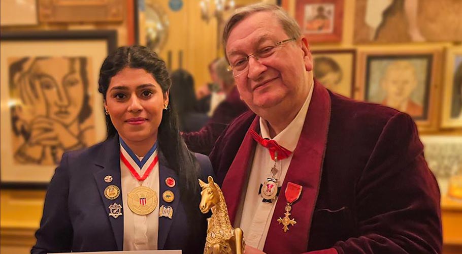 (Photo Caption) Sania Alam with Brain Trust Chairman and Grandmaster of Chess OBE Mr.
Raymond Keene in Soho, London receiving the Brain of the Year Award, for her achievement in improving global mental literacy via super-learning.