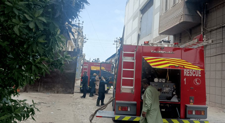 Fire brigade vehicles can be seen present at the location after a fire erupted at a plastics factory in Karachi’s Site-B area on Monday morning. — Photo Dawn.com
