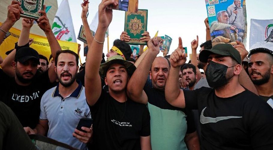 Iraqi protesters in Baghdad carry copies of the Koran to denounce the latest desecration of the holy book in Sweden - Ahmad AL-RUBAYE