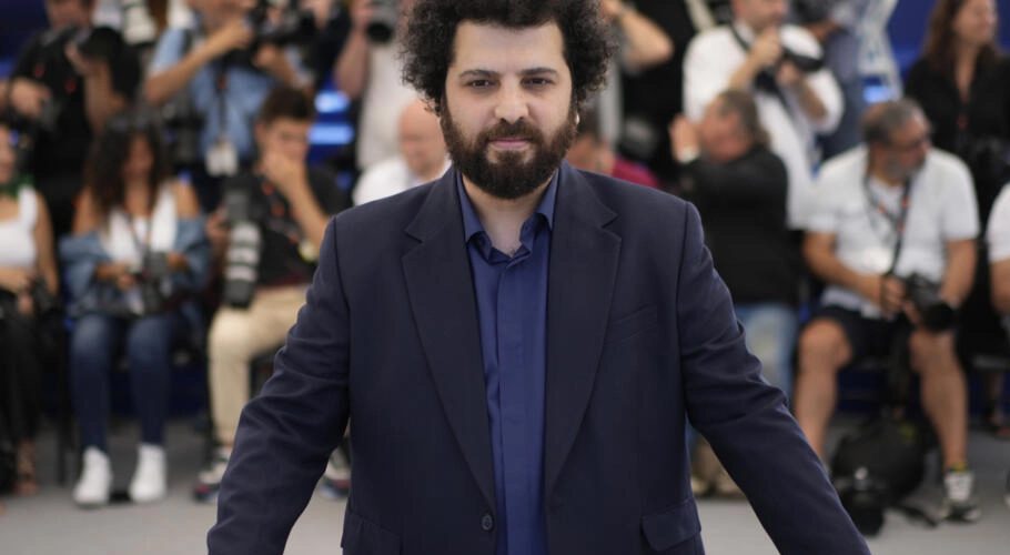 Director Saeed Roustayi poses for photographers at the photo call for the film "Leila's Brothers" at the 75th international film festival, Cannes, southern France, May 26, 2022. © Daniel Cole, AP