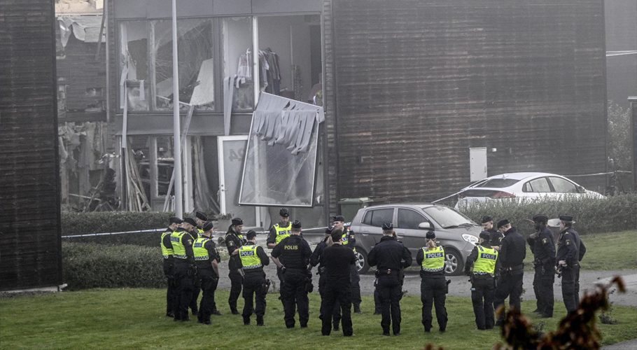 Police stand on the site of a powerful explosion that occurred early Thursday morning Sept. 28, 2023, in a housing area in Storvreta outside Uppsala, Sweden. (Anders Wiklund/TT News Agency via AP)