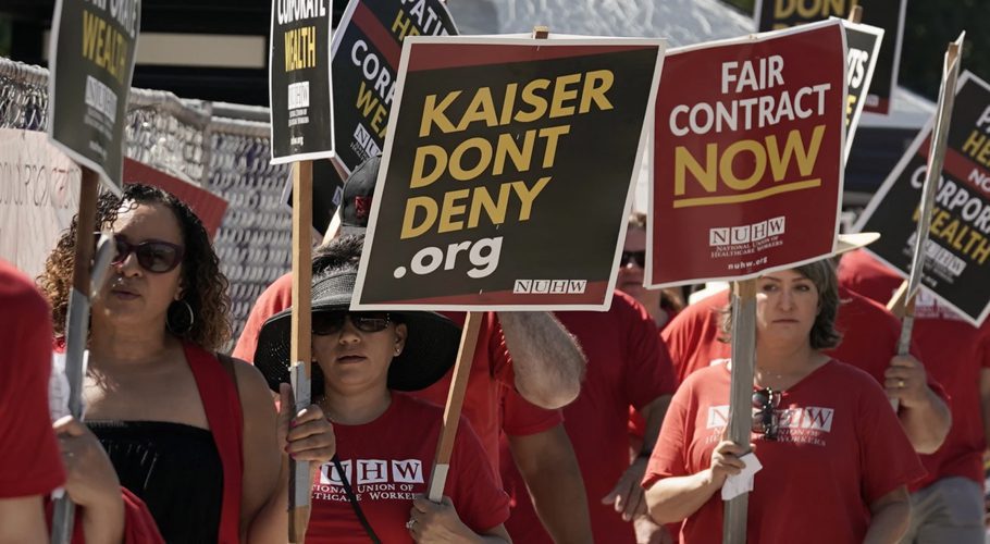 FILE - Kaiser Permanente mental health workers and supporters march outside a Kaiser facility in Sacramento, Calif., Aug. 15, 2022. Roughly 75,000 health care workers at the Kaiser Permanente hospital system are poised to go on a three-day strike at hospitals in California, Colorado, Oregon, Washington, Virginia and Washington, D.C. (AP Photo/Rich Pedroncelli, File)Rich Pedroncelli