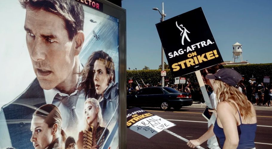 Screen Actors Guild and Writers Guild of America members walk the picket line outside Paramount Pictures in Los Angeles on Friday. Mark Abramson / NYT via Redux
