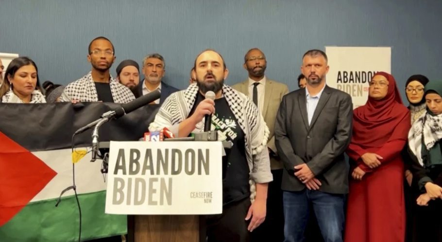 In this image taken from video, Muslim community leaders from several swing states pledge to withdraw support for U.S. President Joe Biden on Saturday, Dec. 2, 2023, at a conference in Dearborn, Mich., citing his refusal to call for a cease-fire in Gaza. (#AbandonBiden via AP)
