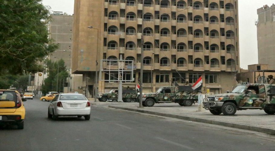 Iraqi security forces stand guard near Baghdad's high-security Green Zone neighbourhood, in which the US embassy is located [File: Sabah Arar/AFP]