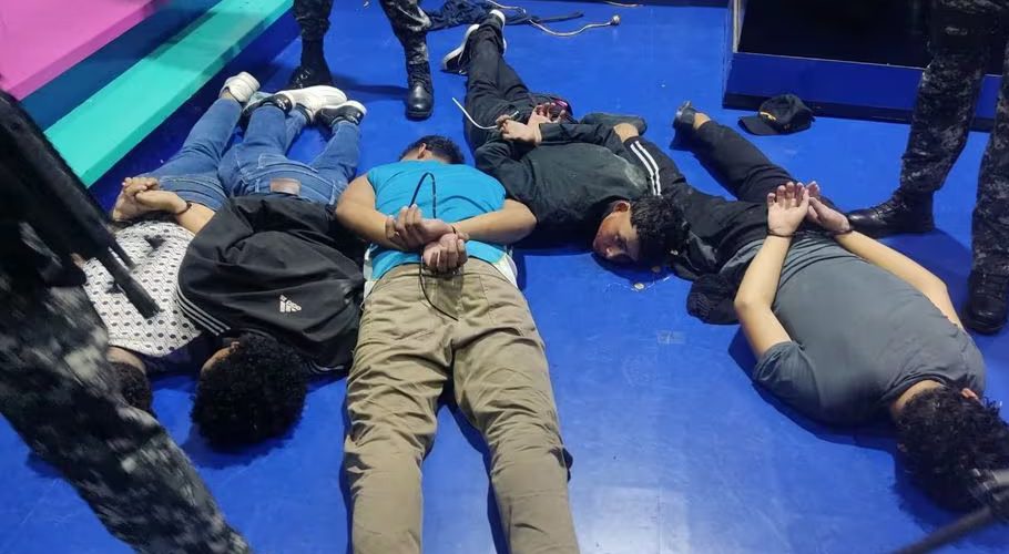 People accused of invading and taking over television station TC with weapons and forcing staff to lie and sit down, lie handcuffed on the floor in a police haundout, in Guayaquil, Ecuador, January 9, 2024. Ecuadorean Police/Handout via REUTERS Acquire Licensing Rights