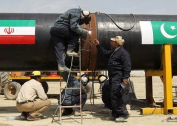 FILE Welders work on a pipeline to transfer natural gas from Iran to Pakistan, in Chabahar on March 11, 2013. — AFP