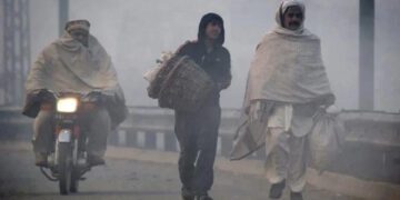 A representational image of men walking on road. — Reuters/File