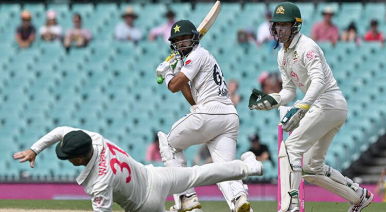 Pakistan’s Aamir Jamal (C) plays a shot as Australia’s David Warner (L) follows the ball during day four of the third cricket Test match between Australia and Pakistan at the Sydney Cricket Ground in Sydney on January 6, 2024. (AFP/File)