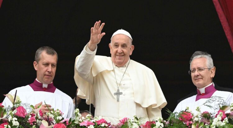FILE Pope Francis waves from the central loggia of St. Peter's basilica during the Easter 'Urbi et Orbi' message and blessing to the City and the World as part of the Holy Week celebrations, in the Vatican on Sunday, March 31, 2024. - AFP