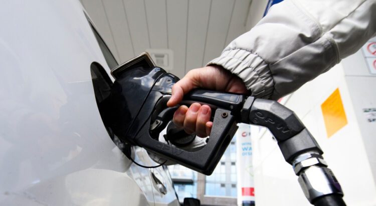 A woman gasses up at a gas station in Mississauga, Ont., Tuesday, February 13, 2024. THE CANADIAN PRESS/Christopher Katsarov