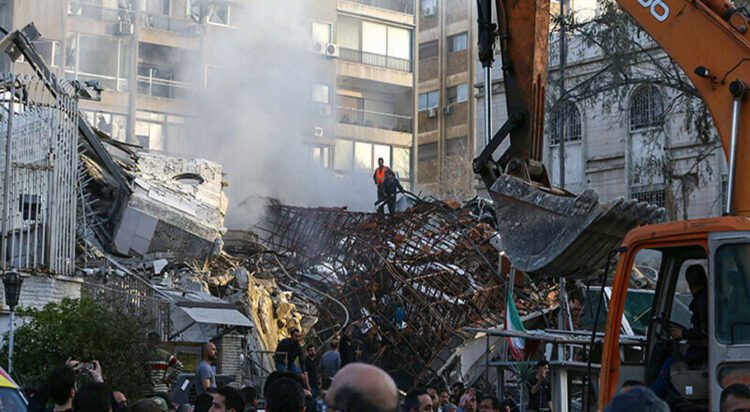 Emergency and security personnel inspect the rubble at the site of strikes which hit a building annexed to the Iranian embassy in Syria’s capital Damascus, on April 1, 2024. — AFP