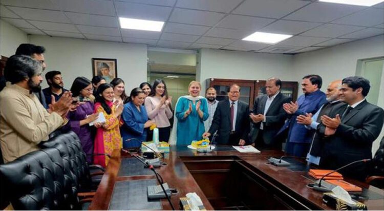 In this handout photograph, taken and released by the Associated Press of Pakistan on May 19, 2024, Pakistani officials celebrate getting an “A status National Human Rights Institution by the Global Alliance of National Human Rights Institutions at the National Commission for Human Rights in Islamabad. (APP)