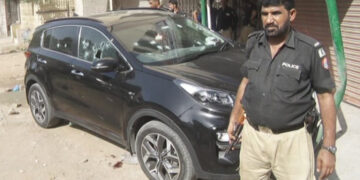 A photograph of the targeted, bullet-ridden car. (Image: Express Tribune)