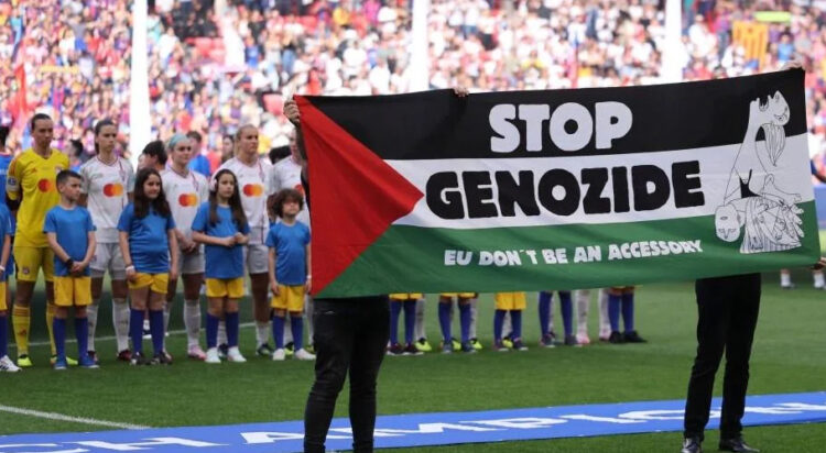 A 'Stop Genocide' banner is presented alongside the players ahead of the UEFA WCL final  (Image: raddit)