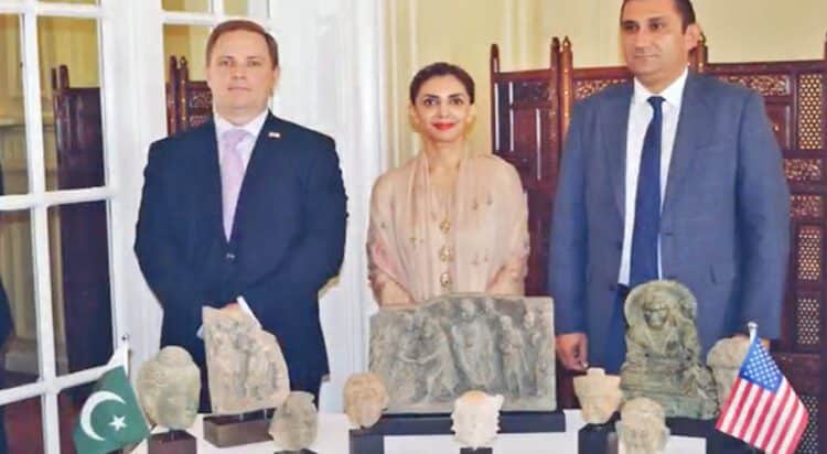 FILE Pakistani diplomats and US Homeland Security official pose for picture at handover ceremony of stolen Pakistani antiquities in New York, US, on August 24, 2021. (Photo courtesy: Pakistan Consulate General New York)