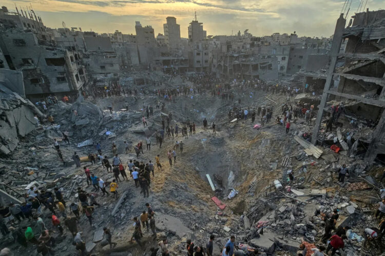 Palestinians search for casualties at the site of Israeli strikes on houses in the Jabalia refugee camp in the northern Gaza Strip on October 31, 2023. According to the Government Media Office in Gaza, more than 313,000 residential units have been destroyed or damaged in Gaza by Israeli bombing. [Anas al-Shareef/Reuters]