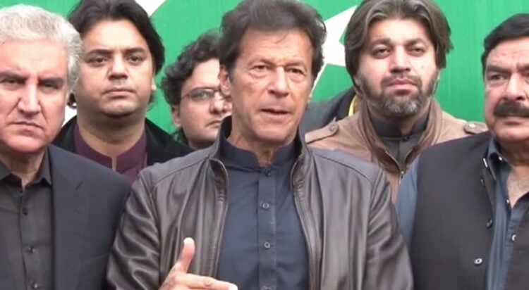 In this file photo, PTI chief Imran Khan addresses a press conference alongside Shah Mahmood Qureshi and Sheikh Rasheed. ─ DawnNewsTV/File