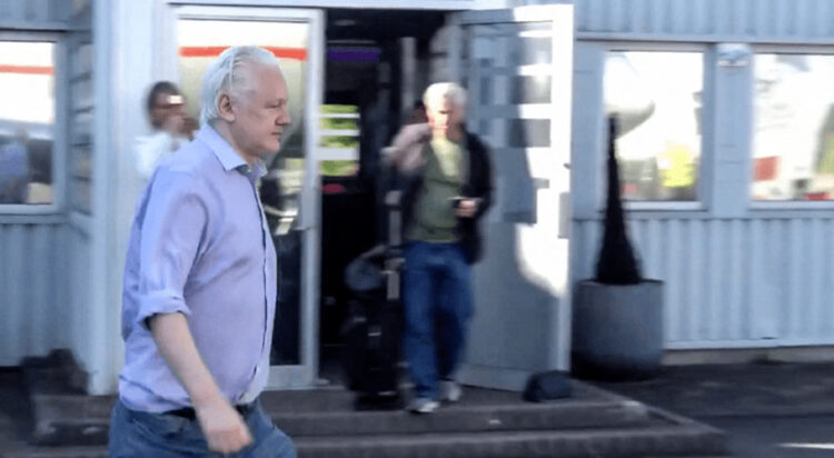This screen shot courtesy of Wikileaks X page shows Wikileaks founder Julian Assange walking to board a plane from London Stansted Airport on June 24, 2024. — AFP
